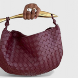 Gerda | Borsa intrecciata con manico dorato
